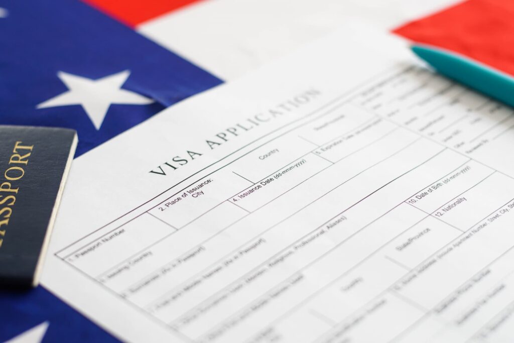 Visa application form with American flag on the background.